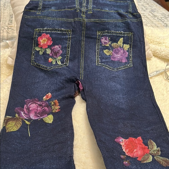 Red and Blue Skinny Jeans with Floral Embroidery with some distress on left leg - Picture 3 of 4